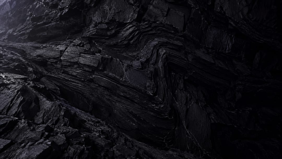 A seam of raw carbon in rock, almost unlit