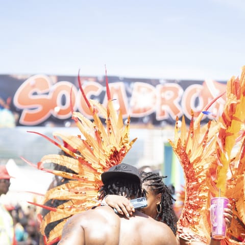 Masqueraders crossing the Socadrome in full costume